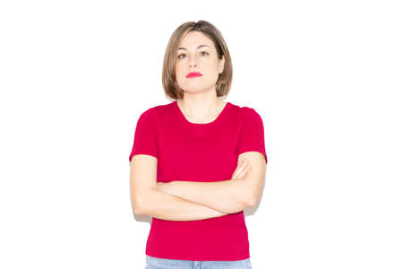 Image of a young woman with crossed arms, bob haircut, green eyes and casual fuchsia T-shirt isolated on a white background.の写真素材