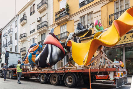 Valencia, Spain - August, 2021: Las Fallas of Valencia returns in 2021 after the coronavirus COVID-19 pandemic, the most important festival. Various parts of a Falla being transported in the assembly dayのeditorial素材