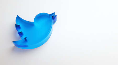 Valencia, Spain - October, 2021: Isolated Twitter logo bird icon, blue symbol for smartphones on white copy space in 3D rendering. Free social media network app for microblogging and sharing messagesのeditorial素材