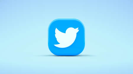 Valencia, Spain - October, 2021: Isolated Twitter logo bird icon, app symbol for smartphones on a blue background in 3D rendering. Free social media network app for microblogging and sharing messagesのeditorial素材