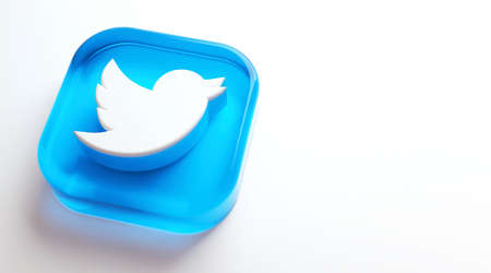 Valencia, Spain - October, 2021: Isolated Twitter logo bird icon, blue button for smartphones on white copy space in 3D rendering. Free social media network app for microblogging and sharing messagesのeditorial素材