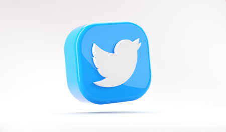 Valencia, Spain - October, 2021: Isolated Twitter logo bird icon, floating blue symbol for smartphones on white in 3D rendering. Free social media network app for microblogging and sharing messagesのeditorial素材