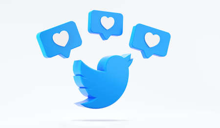Valencia, Spain - October, 2021: Isolated Twitter logo bird icon with like symbols. Free social media app for mobile devices for microblogging and sharing messages with the networkのeditorial素材