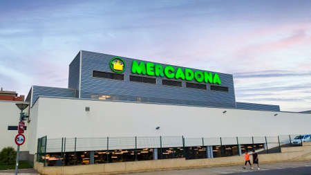 Valencia, Spain - October 5, 2021. Mercadona market brand logo illuminated, view of the facade during the evening. Mercadona is one of the most popular and largest Spanish supermarket chain around Spain and Portugalのeditorial素材