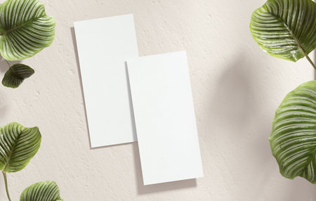 Vertical flyer mockup blank paper for design presentation and stationery concept. White empty brochure template with plants on a neutral textured background, flat lay view in 3D illustrationの写真素材