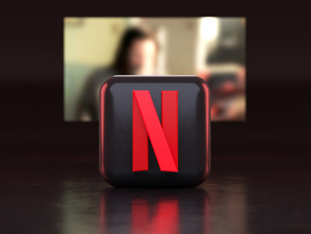 Valencia, Spain - March, 2023: Netflix app in front of a TV screen, icon in 3D illustration. Netflix is a global provider of streaming movies and TV seriesのeditorial素材