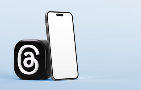 Valencia, Spain - July, 2023: Threads app icon with mobile phone mockup isolated on a blue background in 3D render. Threads is a new social media app for microblogging as an alternative to Twitterのeditorial素材