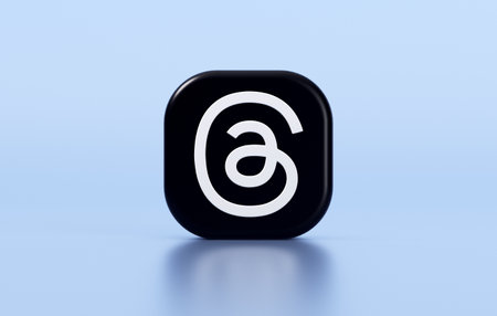 Valencia, Spain - July, 2023: Threads, an Instagram app isolated  on a blue color background in 3D rendering. Threads is a new social media app for microblogging as an alternative to Twitterのeditorial素材