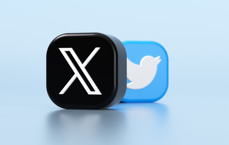 Valencia, Spain - July, 2023: X and Twitter apps on a blue color background in 3D rendering. X is...