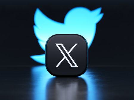 Valencia, Spain - July, 2023: X app in front of the Twitter blue bird symbol background in 3D...