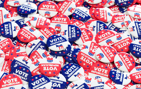 A large pile of red, white and blue vote buttons for Democrat and Republican parties, promoting...
