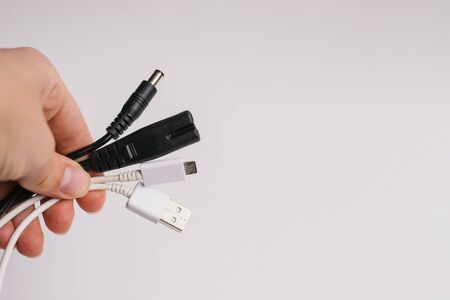 USB charger for your phone or other digital gadget on a white background surface with an empty...