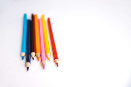 Colored pencils on a white background. Variety of colors. School supplies. Stationery.の写真素材