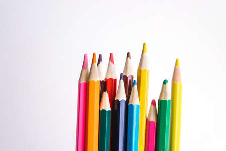 Colored pencils on a white background. Variety of colors. School supplies. Stationery.の写真素材