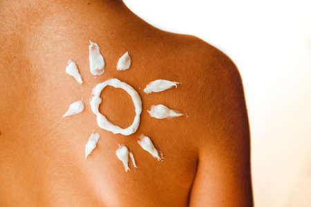 Cream painted the sun on the back of the child. Tanned skin.
