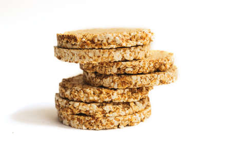 Crunchy and airy bread isolated on a white background, diet crunchy round rice waffles.の写真素材