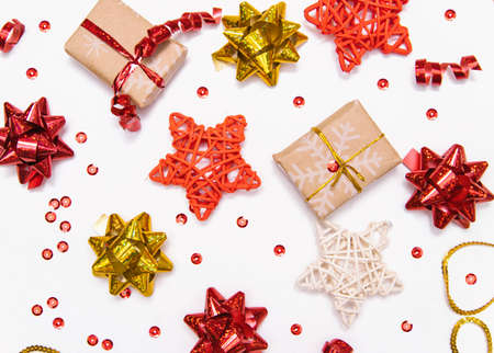 New year's background. Christmas gift. Packed gifts and stars on a white background.