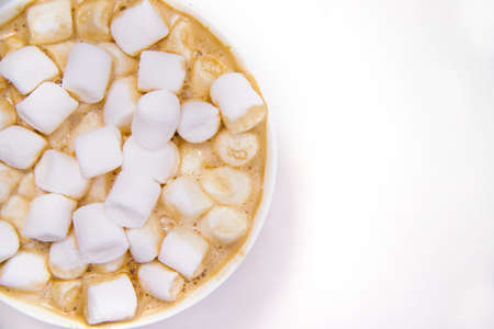Coffee with marshmallows on a white background.Hot winter drink. Cocoa and cappuccino.