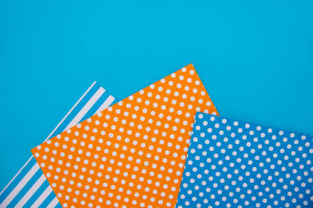 Texture background of fashionable papers in the geometry style. Paper on a blue background.の写真素材
