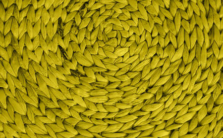 Wicker basket or interior decor close-up. The texture of weaving in a circle. The material is bamboo...