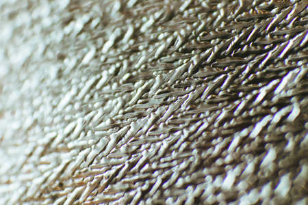 Beautiful abstract background made of material. The texture of aluminum foil. Soft focus. Macro photography. Background blur.の写真素材