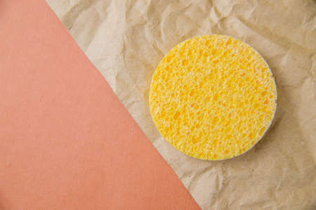 Cosmetic round sponge. The porous texture of the sponge. Cleansing the skin from cosmetics. Hygiene and skin care.の写真素材