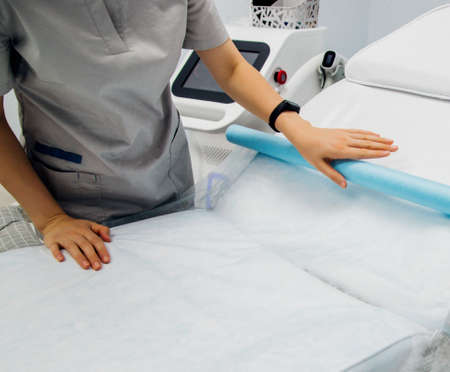 Preparation of the workplace before the laser hair removal procedure. Female hands close-up. Skin care, cosmetic procedures.の写真素材