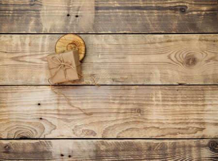 Boxes packed with kraft paper and natural twine on a wooden background. Delivery...