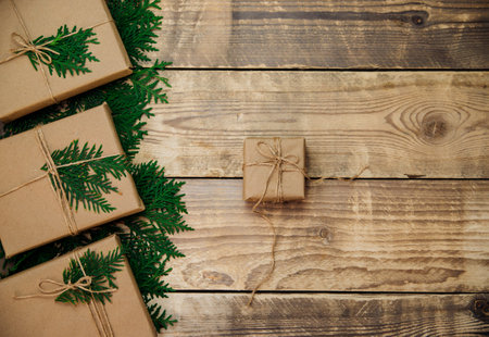 Boxes packed with kraft paper and natural twine on a wooden background. Delivery...