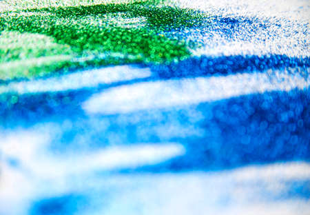 Abstract texture of small sequins. Brilliant festive background. Multicolored sequins on a white background.の写真素材