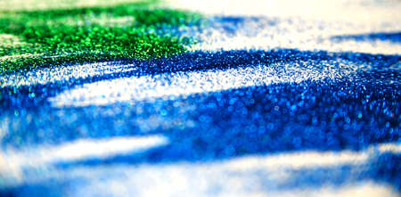 Abstract texture of small sequins. Brilliant festive background. Multicolored sequins on a white background.の写真素材