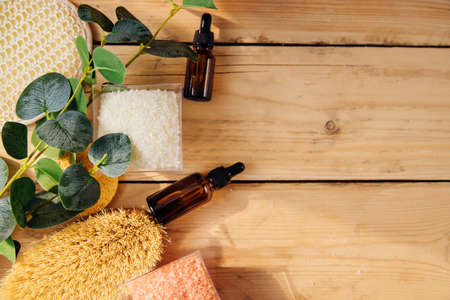 The concept of spa treatment. Natural, organic cosmetics with eucalyptus oil, sea salt, massage...