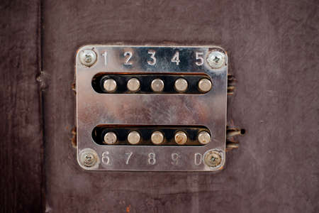 The old combination lock. Entering or leaving the house. An old metal door.