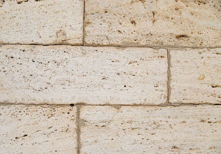 The texture of the stone is beige.Rock, decorative stone. Rough texture of the stone.