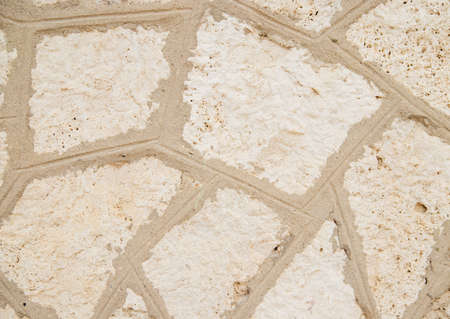 The texture of the stone is beige.Rock, decorative stone. Rough texture of the stone.