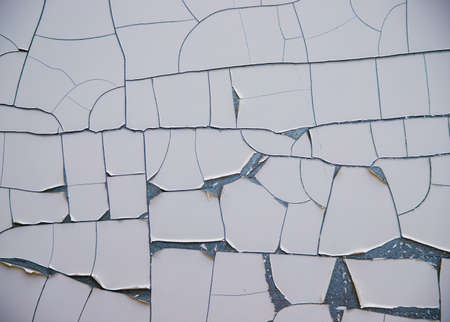 The texture of the wall with cracked white paint. The first layer on the metal surface will be...