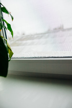 Water drops on the window. Fogging of windows, condensation.