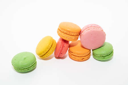 Macarons macaroons cookies dessert from France in a row isolated on a white backgroundの写真素材