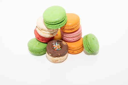 Macarons macaroons cookies dessert from France in a row isolated on a white backgroundの写真素材