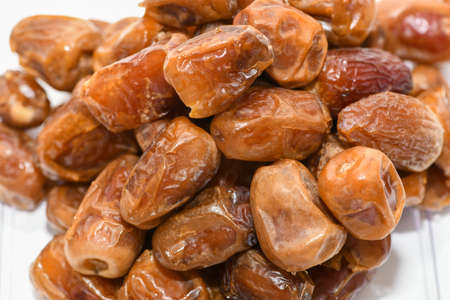 Dried dates isolated on white
