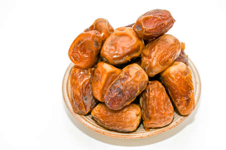 Dried dates isolated on white