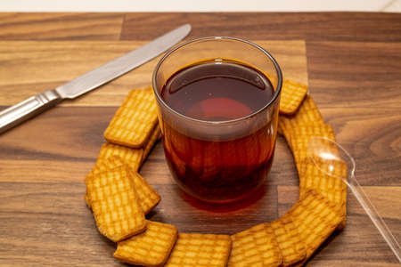 A cup of tea with biscuits for breakfastの写真素材