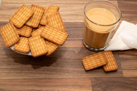 A cup of tea with biscuits for breakfastの写真素材