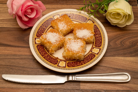 A sweet Arabic basbousa dish on a wooden backgroundの写真素材
