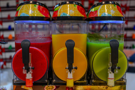 Colorful smoothies for sale in a market in Barcelona, Spain
