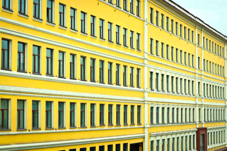 facade of the yellow building with windowsの写真素材