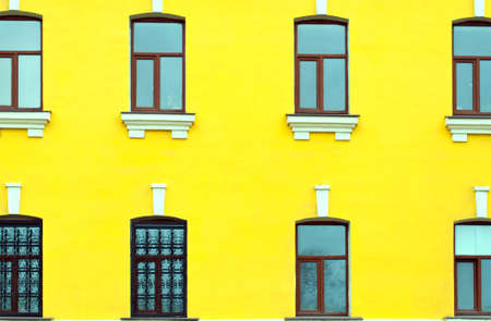 facade of the yellow building with windowsの写真素材