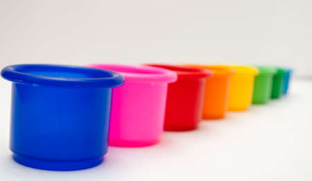 colorful plastic cups on the white backgroundの写真素材