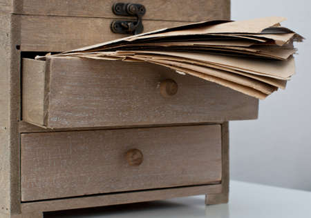 Old wooden box with ancient lettersの写真素材