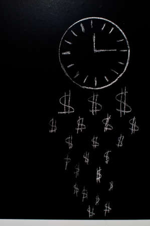 clock and dollar signs are drawn on the blackboard